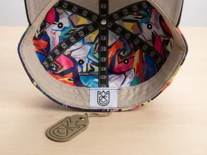 Inside of custom hat showing woven labels and printed taping.