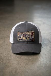 Grey and white trucker cap with premium embroidered Venice bridge artwork on the front panel
