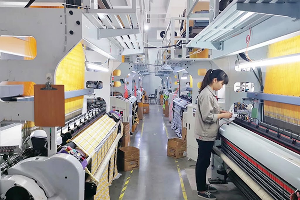 Extreme macro shot of double-warp high-density weaving showing gold thread texture