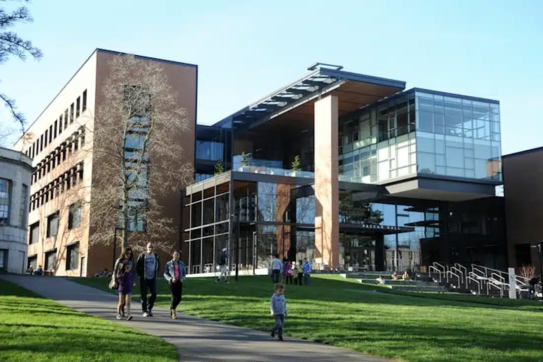 Students walking outside a university campus building