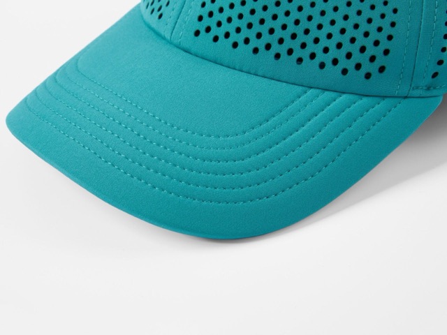 Detail of perforated constructions and visible openings on golf caps
