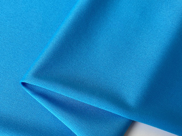 Detail of lightweight woven fabric for golf caps