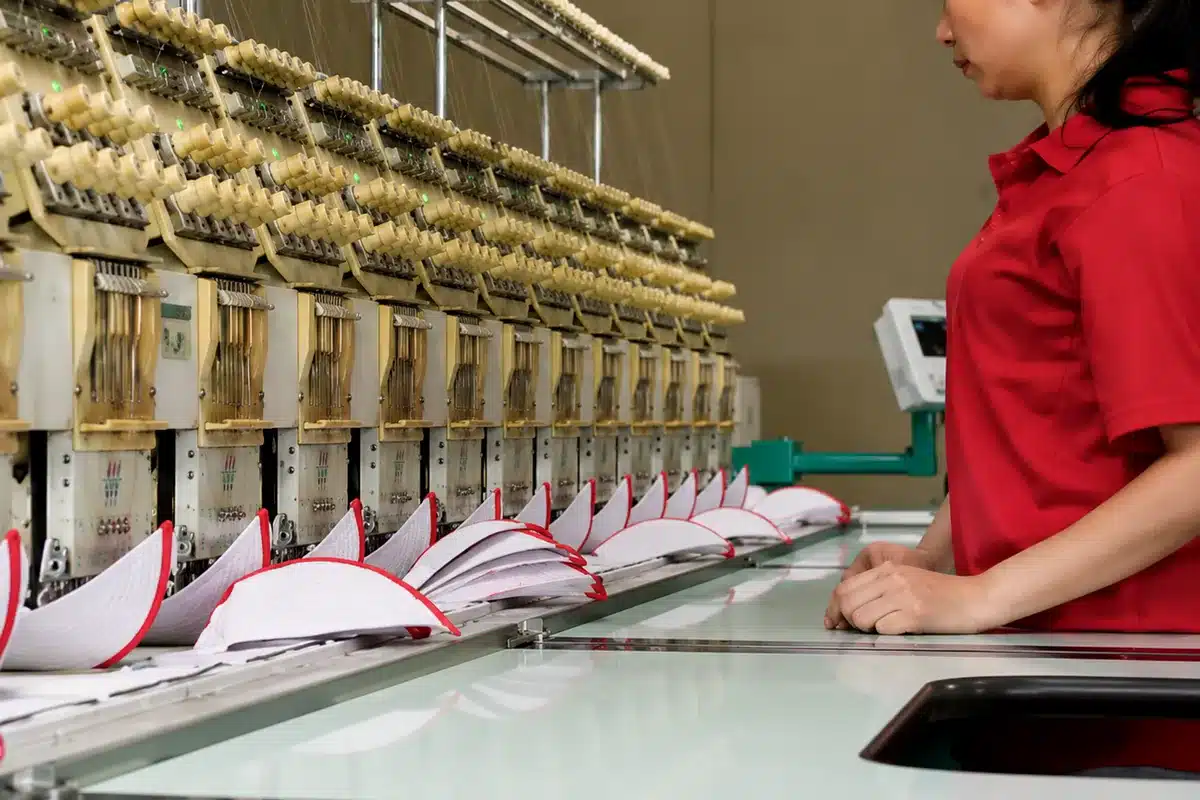 Multi-head embroidery production for structured custom caps