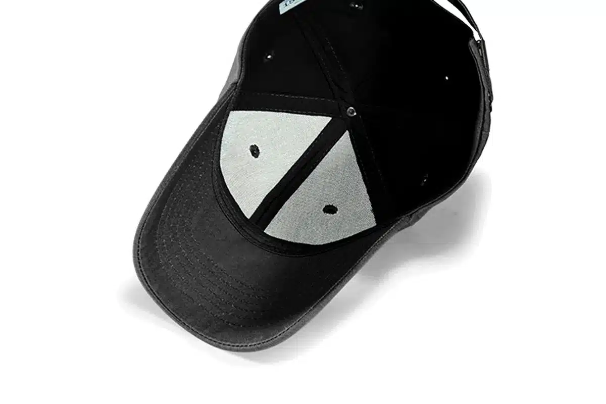 Inside view of a trucker cap with mesh panels and snap closure