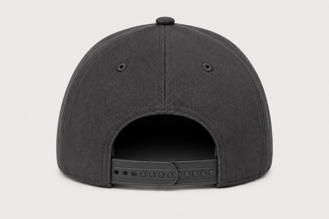Rear view of a charcoal baseball cap with an adjustable plastic snap closure.