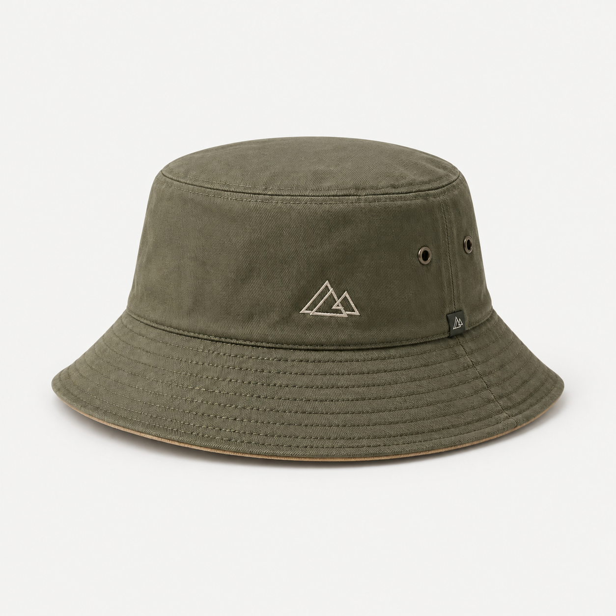 Small flat embroidery on an olive custom bucket hat